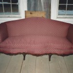 vintage couch with maroon fabric