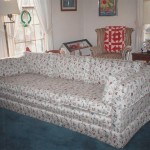 reupholstered couch with white floral fabric