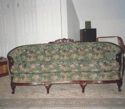 vintage couch with green floral fabric