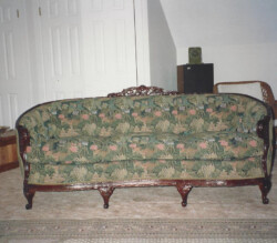 vintage couch with green floral fabric