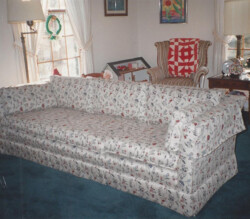 reupholstered couch with white floral fabric