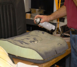 man treating old furniture