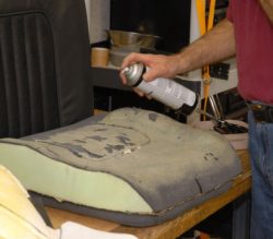 man treating old furniture